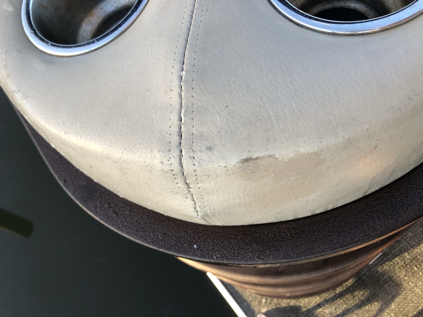 Repaired panel beside the cup holders