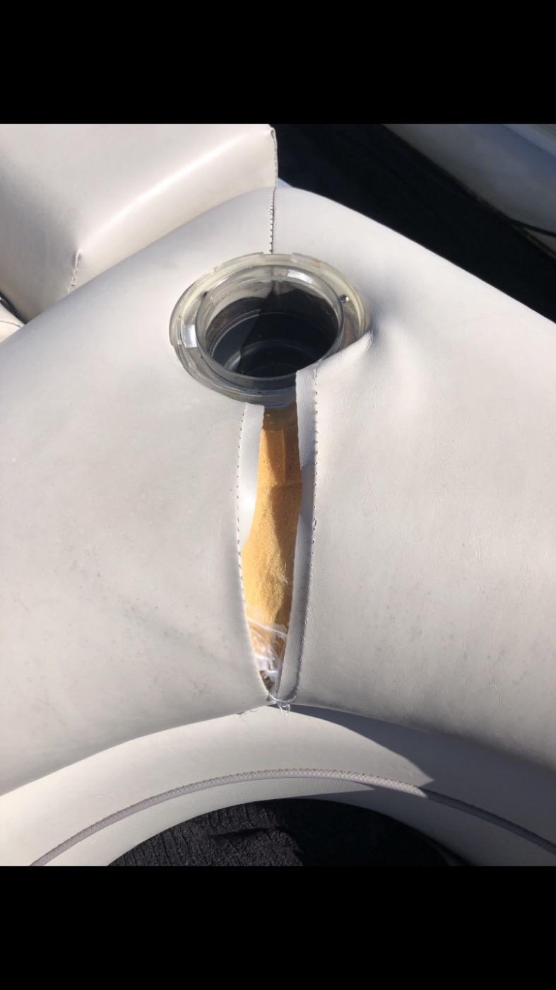 Vinyl split open around the cup holder
